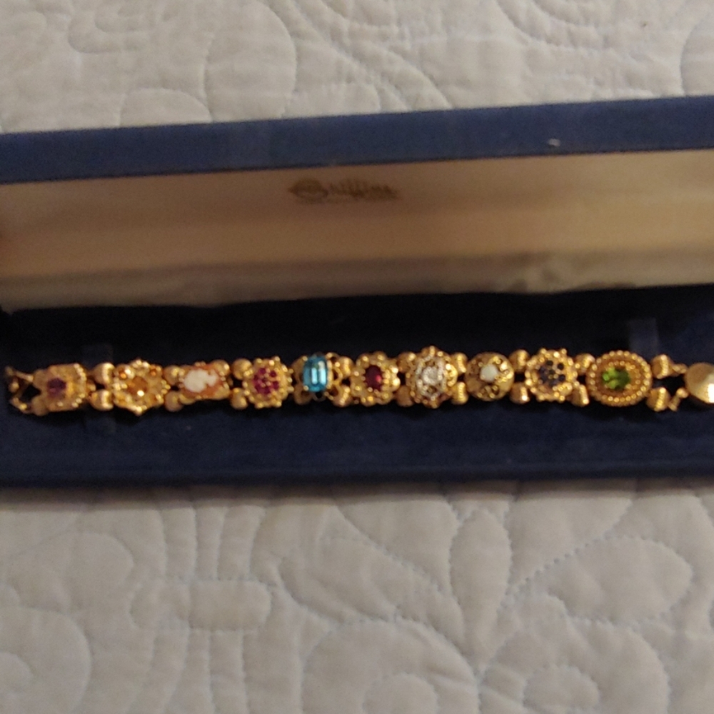 Beautiful 14 k gold slide bracelet with 10 slides.